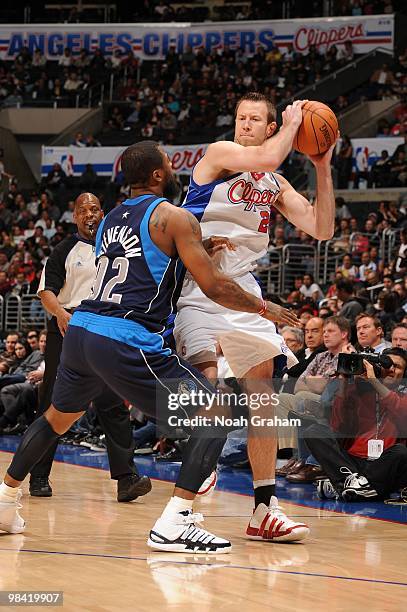 Steve Novak of the Los Angeles Clippers holds the ball against DeShawn Stevenson of the Dallas Mavericks at Staples Center on April 12, 2010 in Los...
