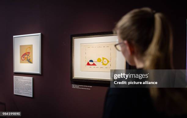 June 2018, Muenster, Germany: A visitor looks at two pictures at exhibition opening of "Das Gehirn - Intelligenz, Bewusstsein, Gefühl" at the LWL...