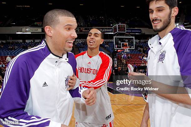 Kevin Martin of the Houston Rockets talks with Francisco Garcia and Omri Casspi of the Sacramento Kings on April 12, 2010 at ARCO Arena in...
