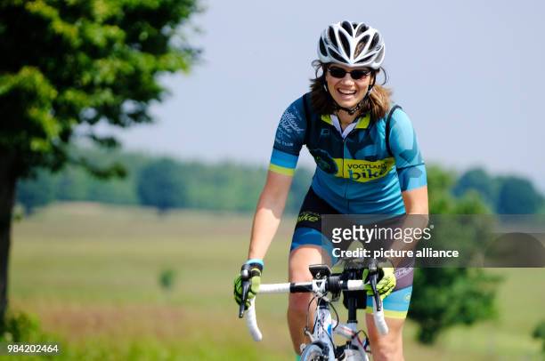 June 2018, Nová Ves V Horách, Czech Republic: Katja Weiß, cycling guide for the route "Stoneman Miriquidi Road" on her bike. On Saturday the guided...