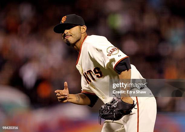 Sergio Romo of the San Francisco Giants reacts after striking out Lastings Milledge of the Pittsburgh Pirates to end the seventh inning at AT&T Park...