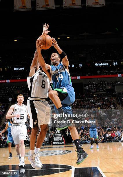 Wayne Ellington of the Minnesota Timberwolves shoots against Roger Mason, Jr. #8 of the San Antonio Spurs on April 12, 2010 at the AT&T Center in San...