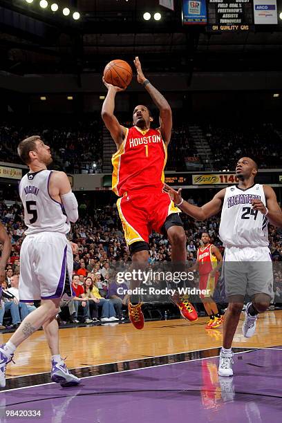 Trevor Ariza of the Houston Rockets gets to the basket against Andres Nocioni of the Sacramento Kings on April 12, 2010 at ARCO Arena in Sacramento,...