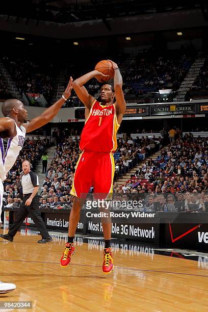 Trevor Ariza of the Houston Rockets shoots the ball over Carl Landry of the Sacramento Kings on April 12, 2010 at ARCO Arena in Sacramento,...