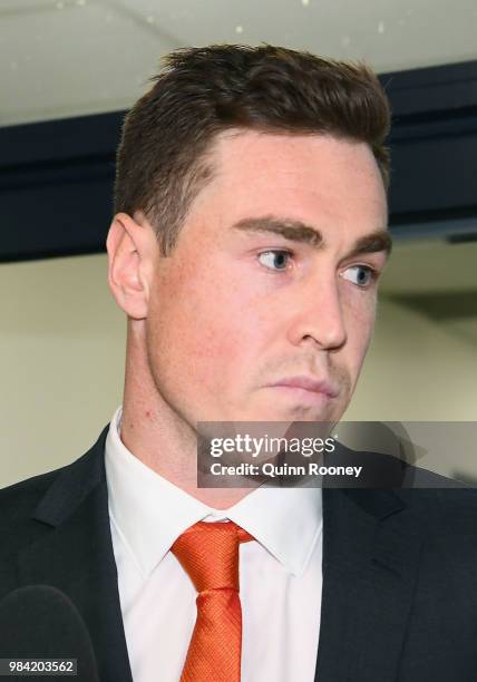 Jeremy Cameron of the Giants walks out of the AFL Tribunal hearing into his striking charge at AFL House on June 26, 2018 in Melbourne, Australia.