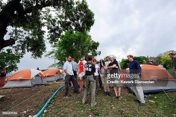 Actor Sean Penn speaks to Susan Sarandon, Demi Moore, Olivia Wilde, Director-Producer Paul Haggis, Gerard Butler,during a visit to a camp for...