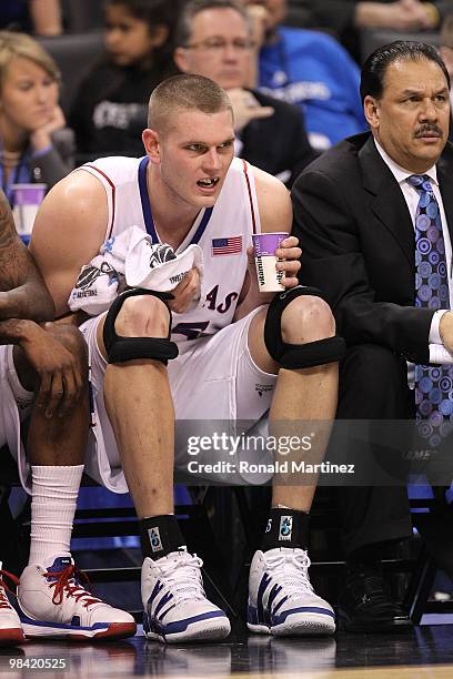 Cole Aldrich of the Kansas Jayhawks appears to be missing a tooth as he sits on the bench against the Northern Iowa Panthers during the second round...