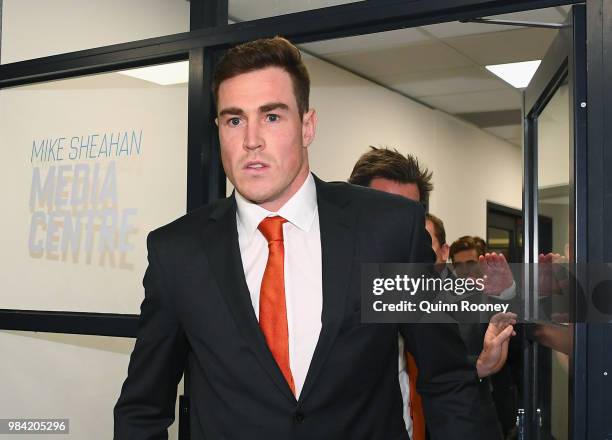 Jeremy Cameron of the Giants walks out of the AFL Tribunal hearing into his striking charge at AFL House on June 26, 2018 in Melbourne, Australia.