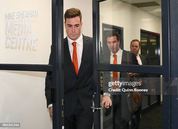 Jeremy Cameron of the Giants walks out of the AFL Tribunal hearing into his striking charge at AFL House on June 26, 2018 in Melbourne, Australia.