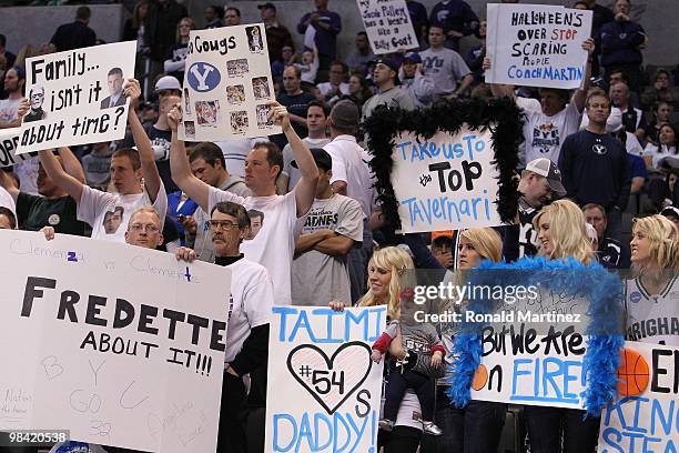 Fans of the Brigham Young Cougars hold signs in support of their team's players including Chris Miles, Jonathan Tavernari, Jackson Emery and Jimmer...