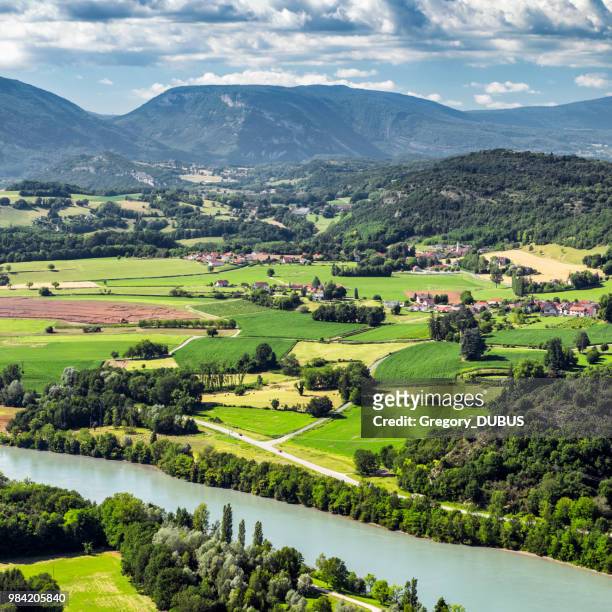 french countryside landscape view of small villages from southern bugey alps mountains in summer with rhone river in auvergne-rhone-alpes region - rhone river stock pictures, royalty-free photos & images
