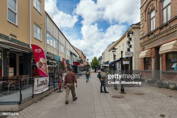 Pedestrians walk past retail stores in Solleftea, Sweden, on Monday, June 18, 2018. When the maternity hospital was closed in the Solleftea district...