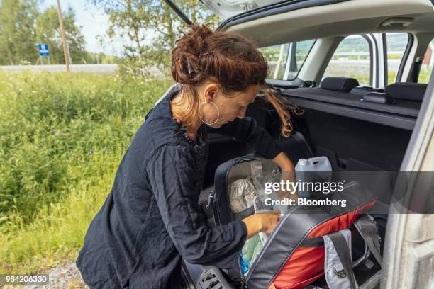 Hanna Hedvall, a midwife, checks her work bag of maternity equipment in the trunk of her car in Solleftea, Sweden, on Monday, June 18, 2018. When the...