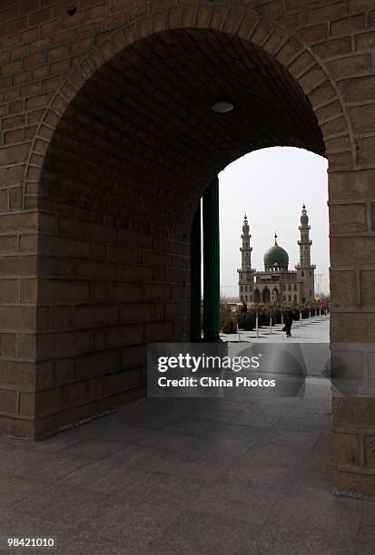 Woman walks at the Muslim dome-shaped tombs on March 14, 2010 in Xihaigu, Tongxin County of Ningxia Hui Autonomous Region, north China. Xihaigu is...