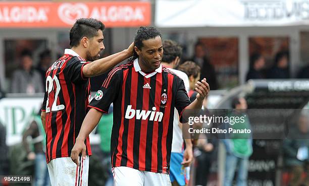 Marco Borriello and Ronaldinho of Milan in action during the Serie A match between AC Milan and Catania Calcio at Stadio Giuseppe Meazza on April 11,...