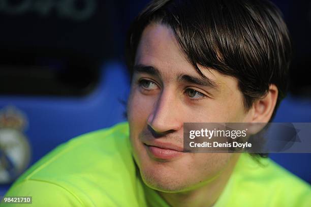 Bojan Krkic of Barcelona looks out from the players dugout before the start of the La Liga match between Real Madrid and Barcelona at the Estadio...