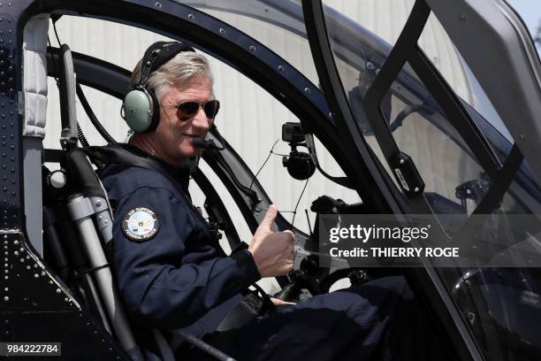 King Philippe - Filip of Belgium gives a thumb-up in a helicopter during the celebration of the 25th anniversary of the Air Support department of the...
