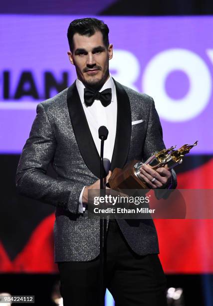 Brian Boyle of the New Jersey Devils accepts the Bill Masterton Memorial Trophy, given for perseverance and dedication to hockey, during the 2018 NHL...