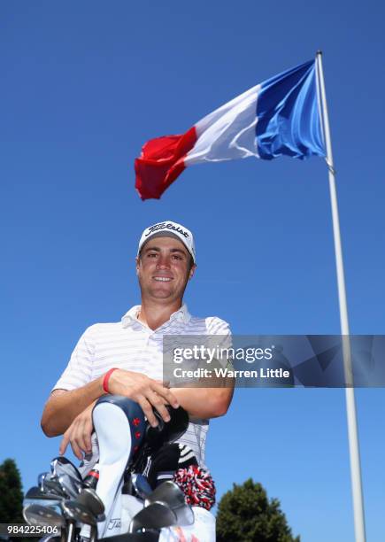 Justin Thomas of the USA poses for a picture with the French flag ahead of the HNA Open de France at Le Golf National on June 26, 2018 in Paris,...