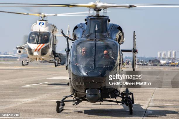 King Philip of Belgium flies an MD902 Explorer helicopter during a visit to the 25th Anniversary of the Federal Police Air Support Directorate in the...