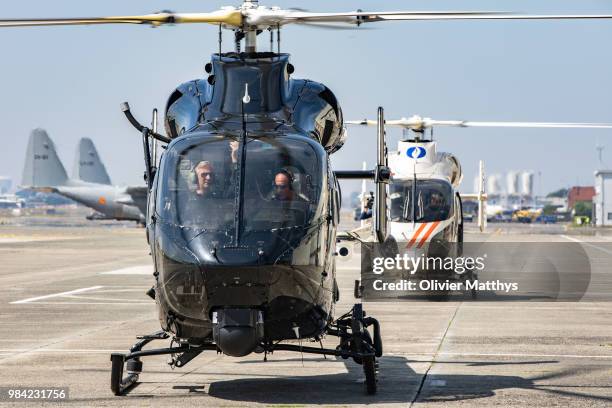 King Philip of Belgium flies an MD902 Explorer helicopter during a visit to the 25th Anniversary of the Federal Police Air Support Directorate in the...