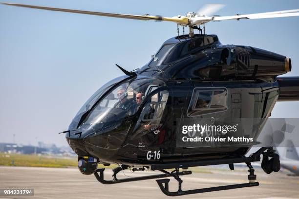 King Philip of Belgium flies an MD902 Explorer helicopter during a visit to the 25th Anniversary of the Federal Police Air Support Directorate in the...