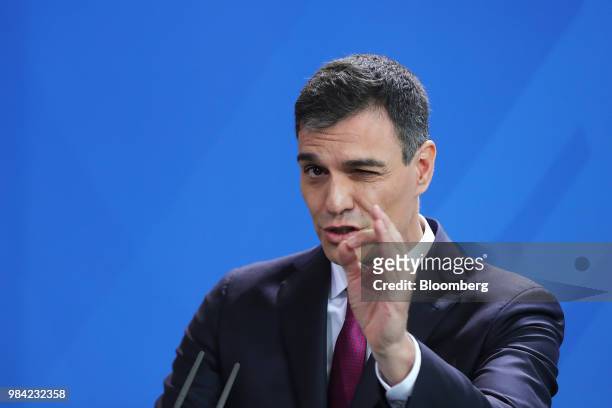 Pedro Sanchez, Spain's prime minister, gestures while speaking during a news conference with Angela Merkel, Germany's chancellor, in the Chancellery...