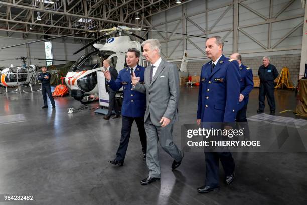 King Philippe - Filip of Belgium walks past helicopter during the celebration of the 25th anniversary of the Air Support department of the federal...