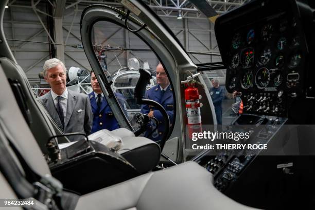 King Philippe - Filip of Belgium looks at a helicopter during the celebration of the 25th anniversary of the Air Support department of the federal...