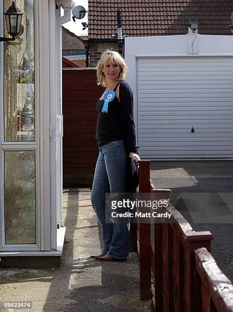 Conservative candidate Caroline Dinenage knocks on the door of a potential voter as she campaigns in the constituency of Gosport in Hampshire on...