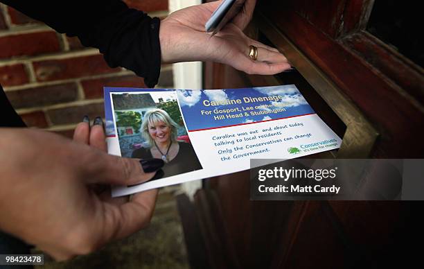 Conservative candidate Caroline Dinenage delivers pamplets as she campaigns in the constituency of Gosport in Hampshire on April 10, 2010 in Gosport,...