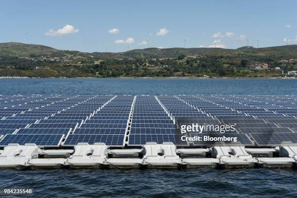 Solar panels containing photovoltaic cells float on water at the hydro electric dam project by EDP-Energias de Portugal SA's renewables unit, EDP...