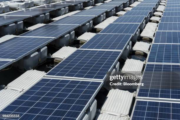 Solar panels containing photovoltaic cells float on water at the hydro electric dam project by EDP-Energias de Portugal SA's renewables unit, EDP...