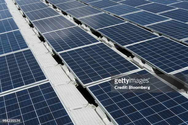 Solar panels containing photovoltaic cells float on water at the hydro electric dam project by EDP-Energias de Portugal SA's renewables unit, EDP...