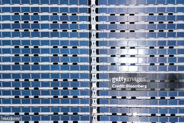 Solar panels containing photovoltaic cells float on water at the hydro electric dam project by EDP-Energias de Portugal SA's renewables unit, EDP...