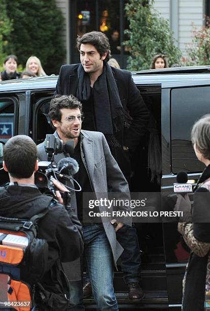 French actors Patrick Bruel and Mathieu Delarive arrive on April 12, 2010 in Lomme, for the premiere of the movie "Comme les cinq doigts de la main"...