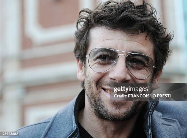 French actor Patrick Bruel poses on April 12, 2010 in Lomme, before attending the premiere of the movie "Comme les cinq doigts de la main" directed...