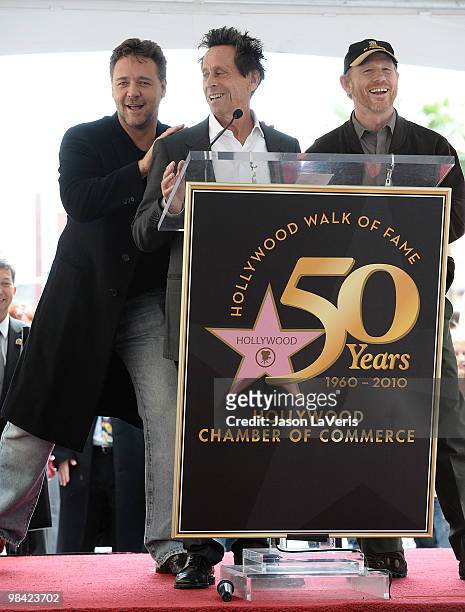 Actor Russell Crowe, producer Brian Grazer and producer Ron Howard attend Russell Crowe's induction into the Hollywood Walk Of Fame on April 12, 2010...