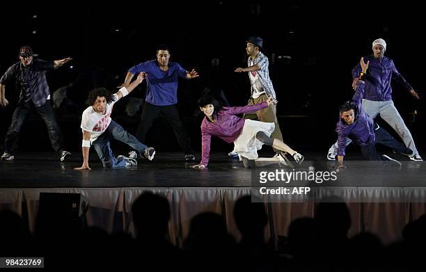Dancers of the "Flying Steps" ensemble perform on stage to the music of Johann Sebastian Bach at the New National Gallery in Berlin on April 12,...