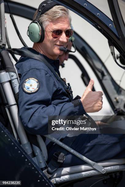 King Philip of Belgium flies an MD902 Explorer helicopter during a visit to the 25th Anniversary of the Federal Police Air Support Directorate in the...