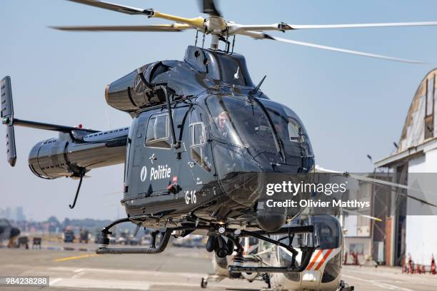 King Philip of Belgium flies an MD902 Explorer helicopter during a visit to the 25th Anniversary of the Federal Police Air Support Directorate in the...