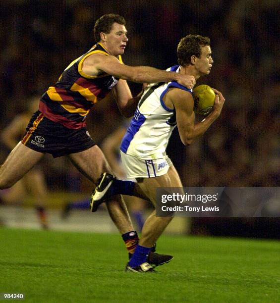 Corey Jones for the Kangaroos marks ahaead of Ken McGregor for Adelaide in the round 5 match of the AFL between the Adelaide Crows and the Kangaroos...