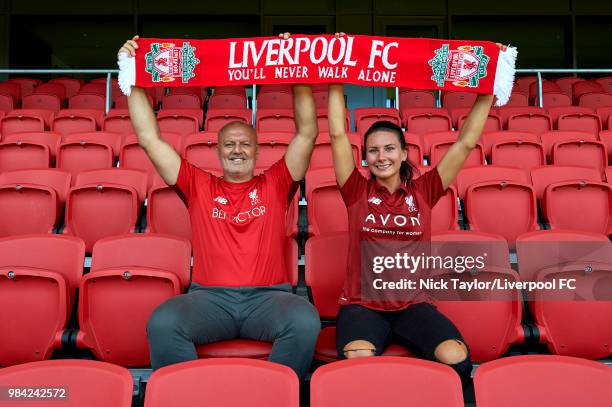 Leighanne Robe poses for a photo with Neil Redfearn, Liverpool Ladies manager after signing for Liverpool Ladies at Anfield on June 25, 2018 in...