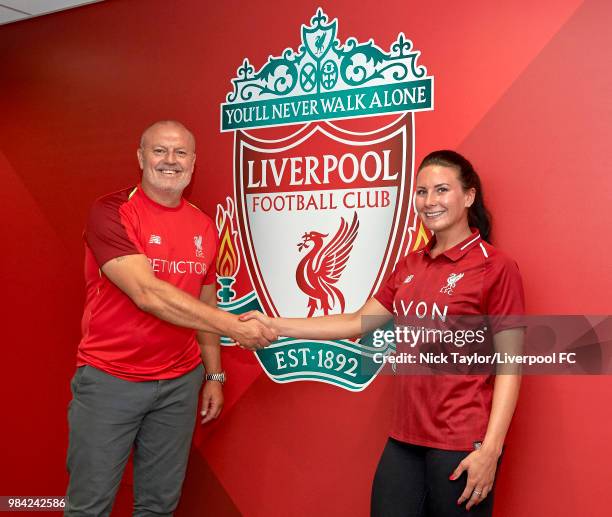 Leighanne Robe poses for a photo with Neil Redfearn, Liverpool Ladies manager after signing for Liverpool Ladies at Anfield on June 25, 2018 in...