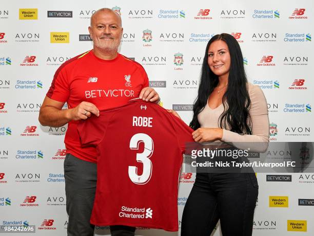 Leighanne Robe poses for a photo with Neil Redfearn, Liverpool Ladies manager after signing for Liverpool Ladies at Anfield on June 25, 2018 in...