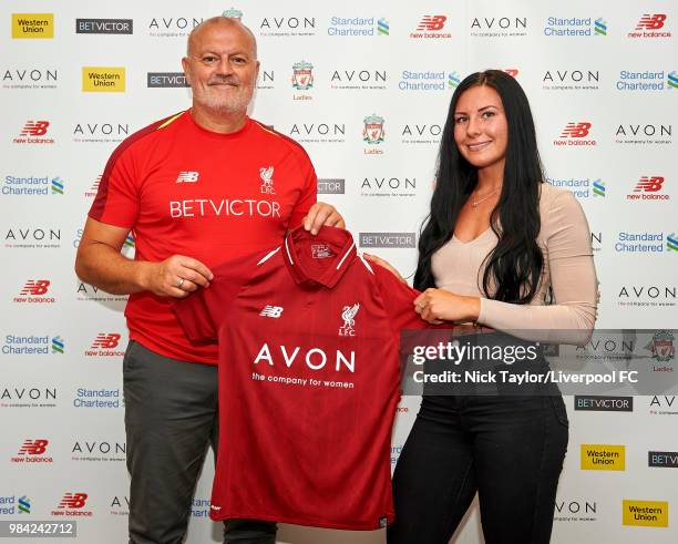 Leighanne Robe poses for a photo with Neil Redfearn, Liverpool Ladies manager after signing for Liverpool Ladies at Anfield on June 25, 2018 in...