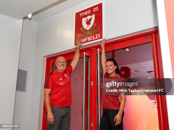 Leighanne Robe poses for a photo with Neil Redfearn, Liverpool Ladies manager after signing for Liverpool Ladies at Anfield on June 25, 2018 in...