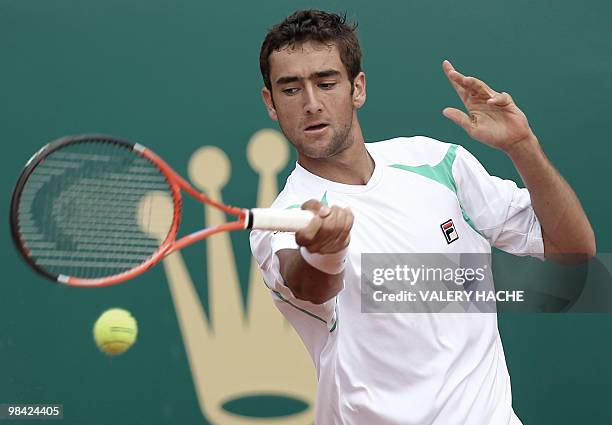 Croatian player Marin Cilic hits a return to his Russian opponent Igor Andreev during their Monte-Carlo ATP Masters Series Tournament tennis match,...