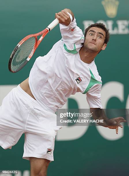 Croatian player Marin Cilic serves to his Russian opponent Igor Andreev during their Monte-Carlo ATP Masters Series Tournament tennis match, on April...