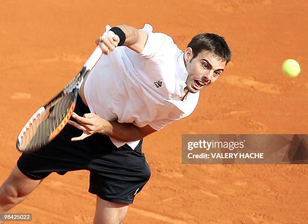 Spanish Marcel Granollers hits to return to World number nine Spanish Juan Carlos Ferrero during the Monte-Carlo ATP Masters Series Tournament tennis...